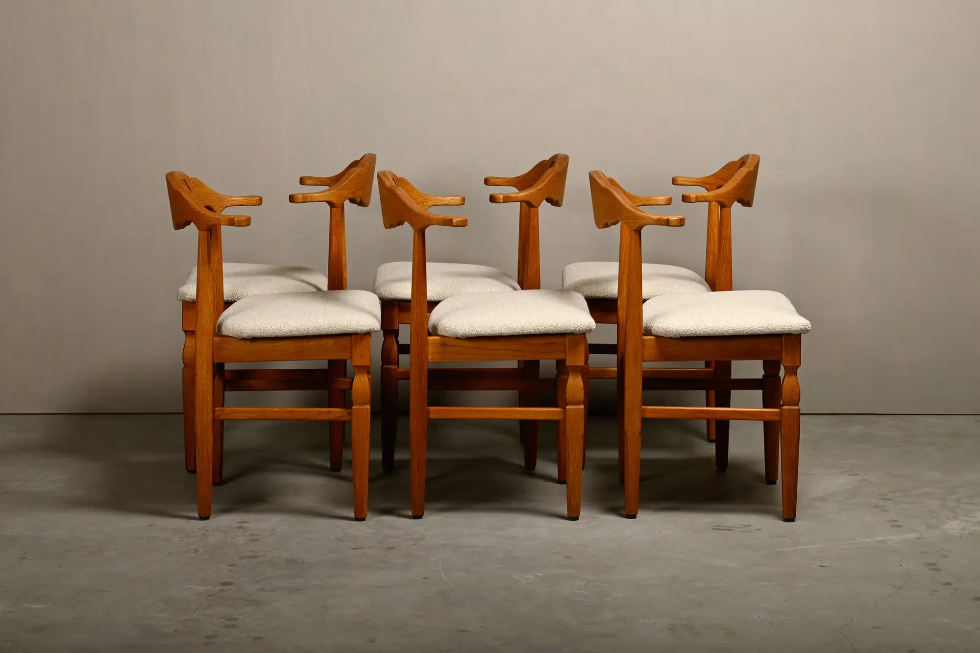 Henning Kjærnulf dining chairs set in Oak and Off White Bouclé, Denmark, 1960s