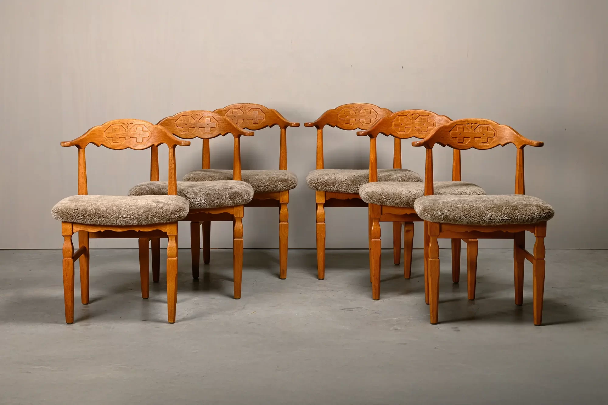Henning Kjærnulf dining chairs set in Oak and Lambswool, Denmark, 1960s