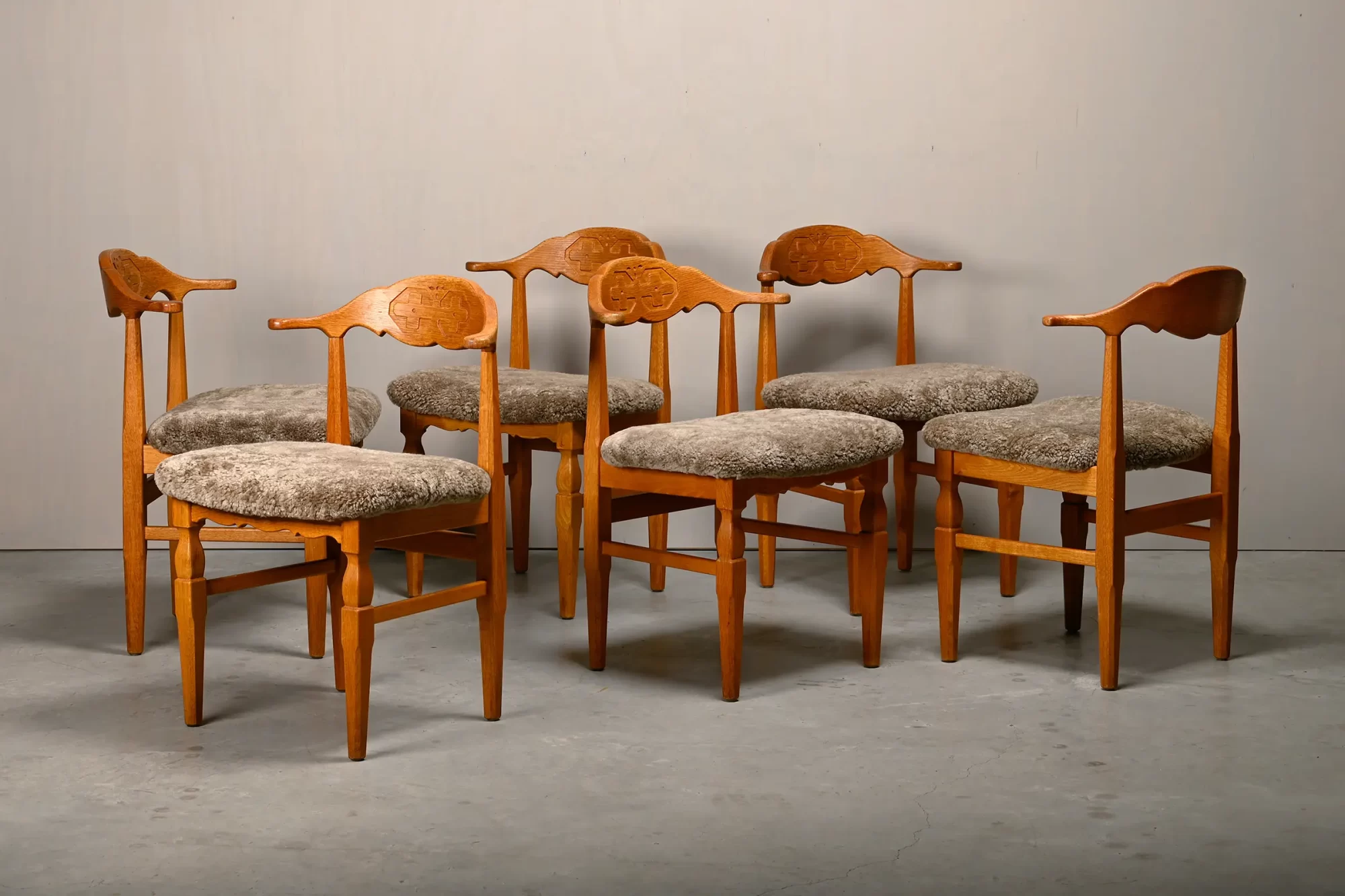 Henning Kjærnulf dining chairs set in Oak and Lambswool, Denmark, 1960s