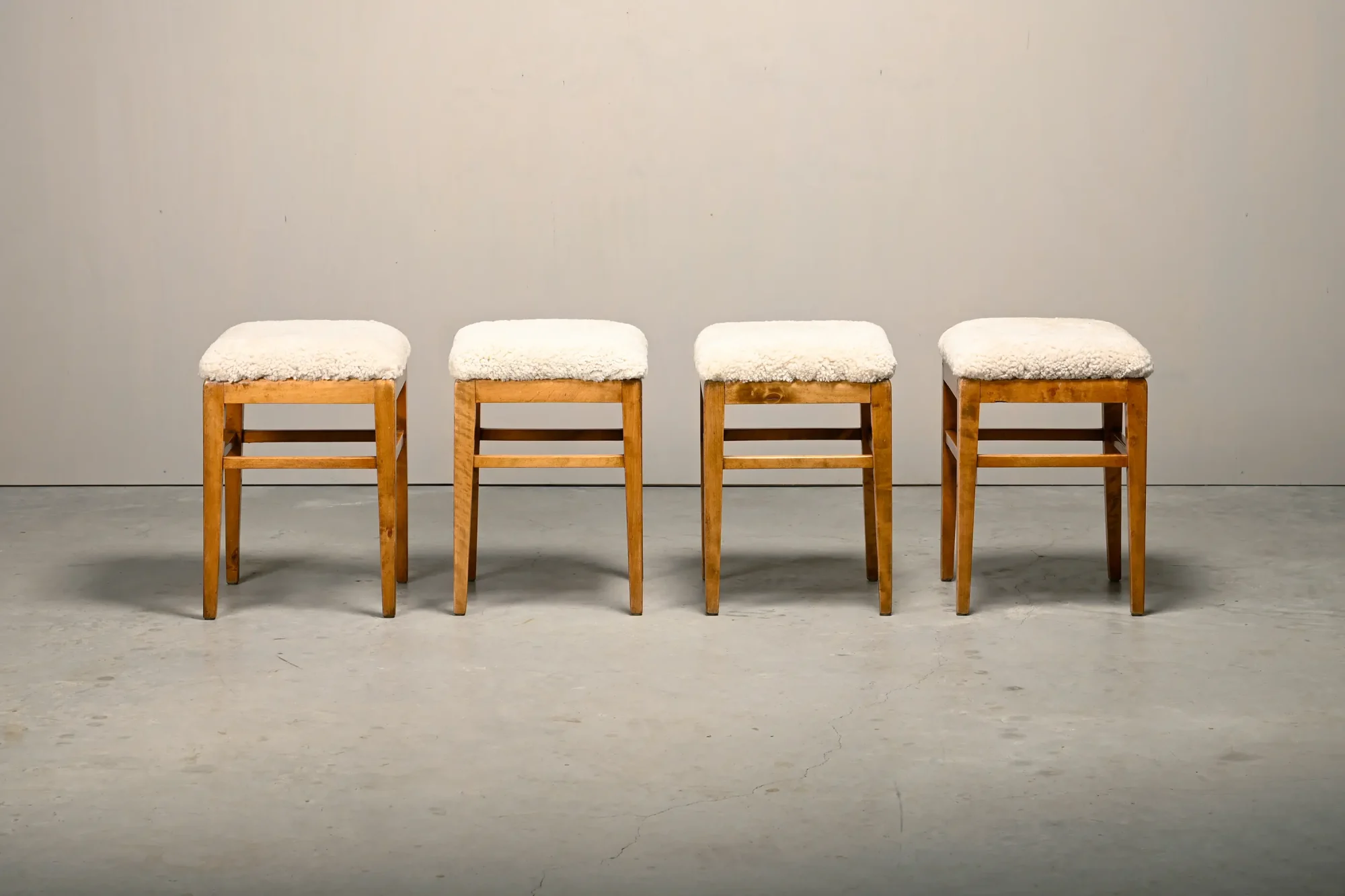 Scandinavian birch stools with light sheepskin seats, 1930s