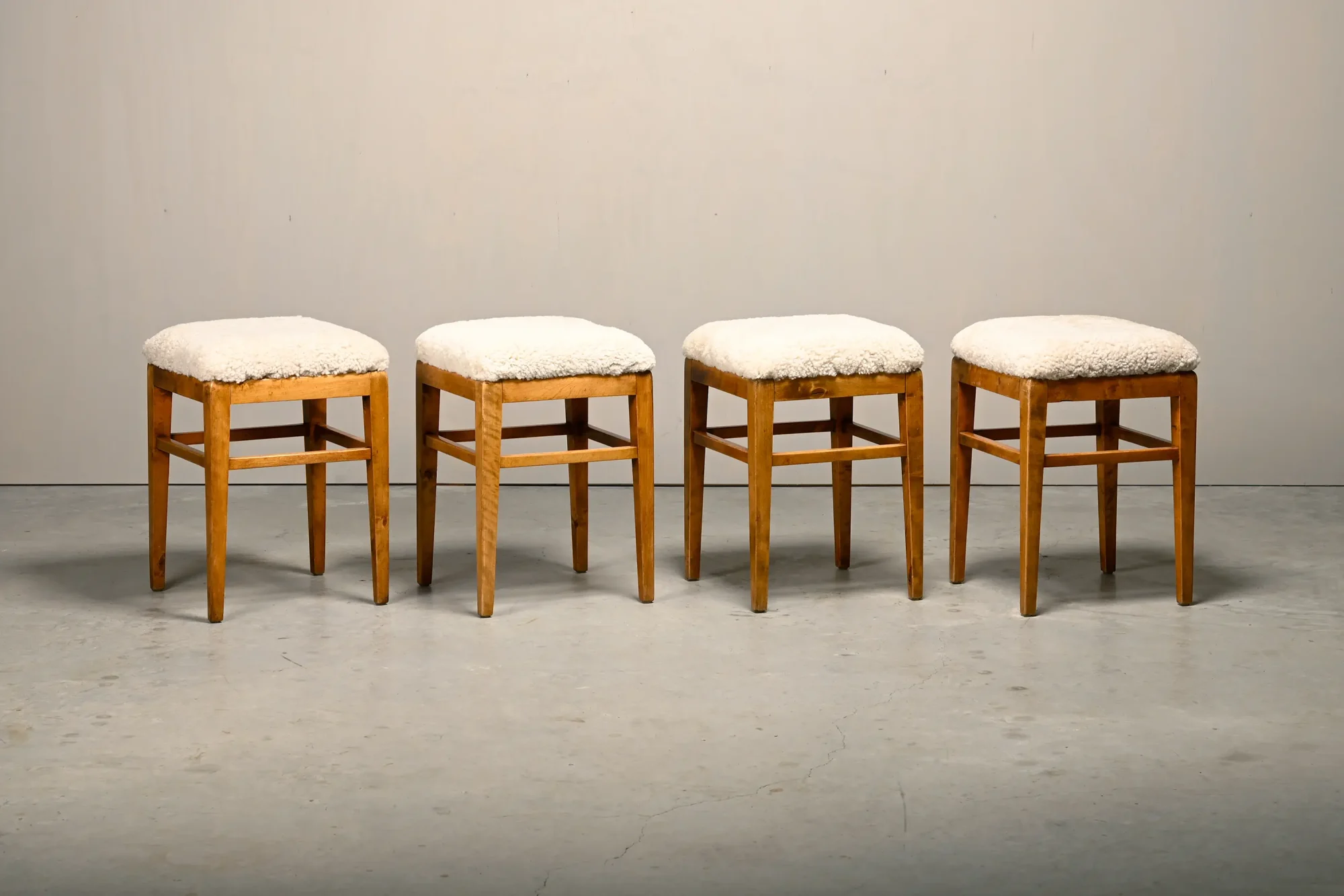 Scandinavian birch stools with light sheepskin seats, 1930s